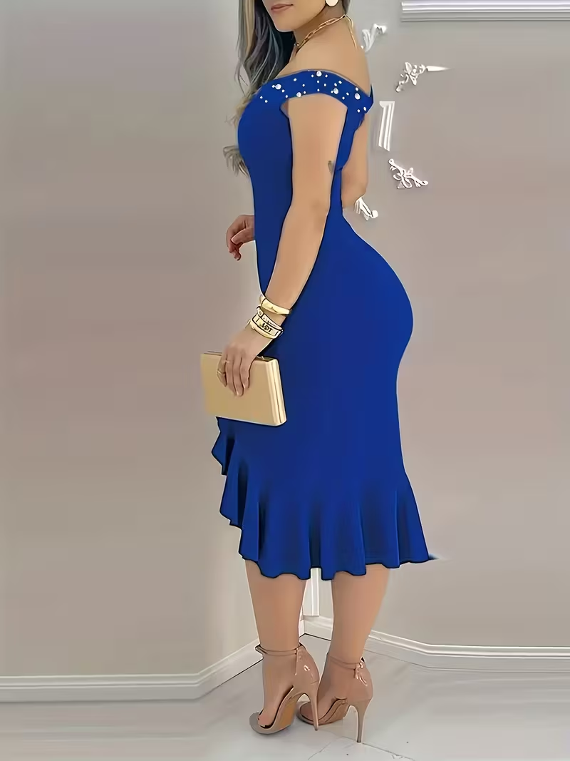 This dress is a striking royal blue, form-fitting design that beautifully accentuates the figure with a sleek, elegant silhouette.